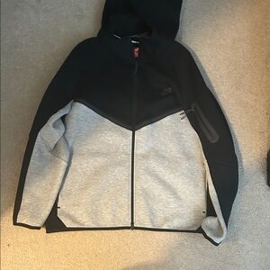 Nike Tech Black and Grey jacket.
